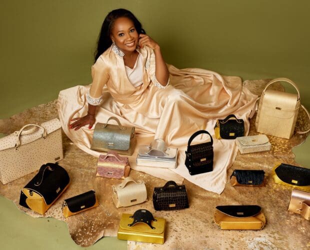Zainab Aliyu surrounded by luxury leather aaboux bags